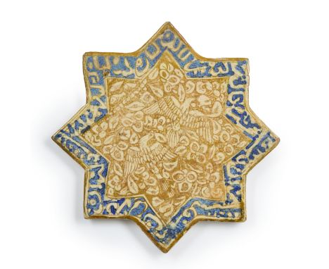 A lustre-painted pottery star tile,  Iran, dated 668AH/1267-70AD, decorated in a brown lustre on a white glaze with a central
