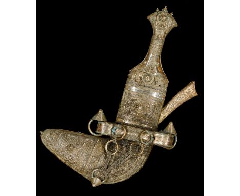 A presentation dagger (jambiyya), Possibly Oman or Yemen, Arabic Peninsula, 20th century,Mounted and framed, 30cm. long, 52 x
