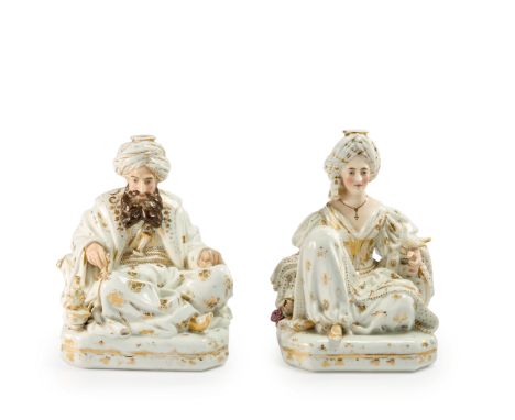 A pair of Jacob Petit porcelain figural scent bottles of a seated Sultan and Sultana, Attributed to Jacob Petit, France, mid-