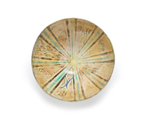 A cobalt, turquoise blue, black and white rounded pottery bowl,  Kashan, Central Iran, 14th century, On short foot, the radia