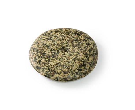 A Neolithic polished granite stone disk,  Western Sahara, circa 3rd Millennium B.C.Of rounded form with curved cutting edge a