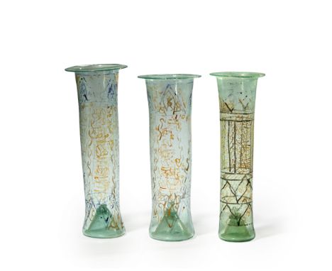 Three near clear glass cylindrical lamps,  Syria or Ottoman provinces, 19th century, Each with flat lip, loose gilt calligrap