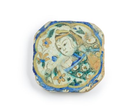 A figural pottery tile fragment,  Kubachi, Safavid Iran, 17th century, the polychrome painted decoration consisting of a bust