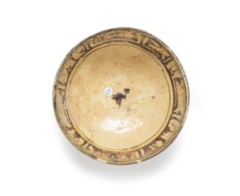 A small calligraphic rounded pottery bowl,  Nishapur, northeast Iran, 10th century, On straight ribbed foot, the rim with a w