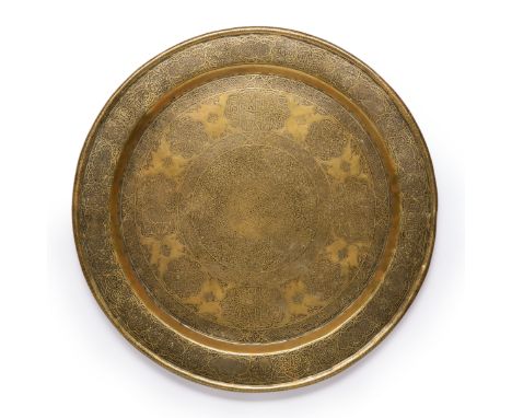 An engraved copper alloy circular tray,  Ottoman provinces, early 20th century, In the Veneto-Saracenic style, the large cent