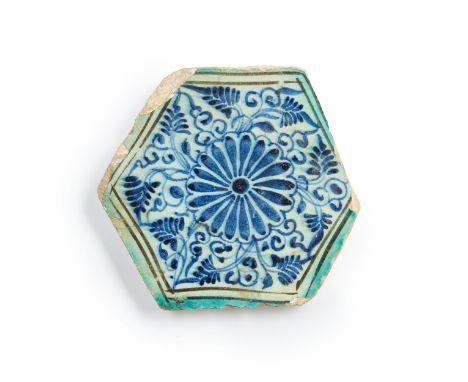 An hexagonal pottery tile, Mamluk Egypt or Syria, 15th Century,The cobalt-blue painted decoration consisting of a central flo