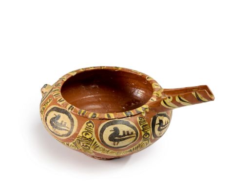 A long spouted squat pottery pouring vessel, Nishapur, eastern Iran, 10th century, Shallow, with a slightly rising trough spo