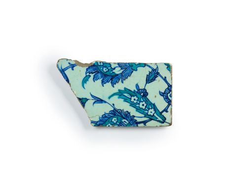 A fragmentary blue, turquoise blue and white Iznik pottery tile,   Ottoman Provinces, 16th century,the underglaze painted dec