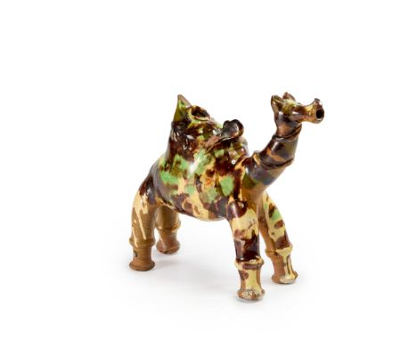 A splashware pottery figure of a standing camel, Canakkale, Ottoman Turkey, 19th century, Painted in cream, brown and green, 
