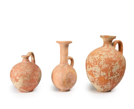 A Cypriot black-on-red ware pottery round-lipped ochinoe, Iron Age, 750-600 B.C., the tall, cylindrical neck with wide everte
