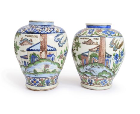 A pair of Qajar pottery baluster vases, Iran, end of the 19th/early 20th centuryUnderglaze painted in cobalt blue, manganese,