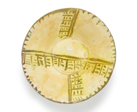 A conical pottery bowl,  Nishapur, northeast Iran, 10th century, On short foot, the well and cavetto painted with perpendicul