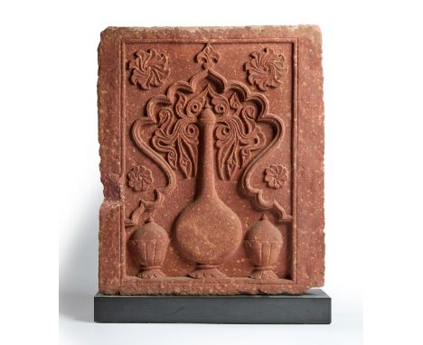 A fine Mughal red sandstone Chini Kana panel,  North India, first quarter 17th centuryOf rectangular form, the large central 