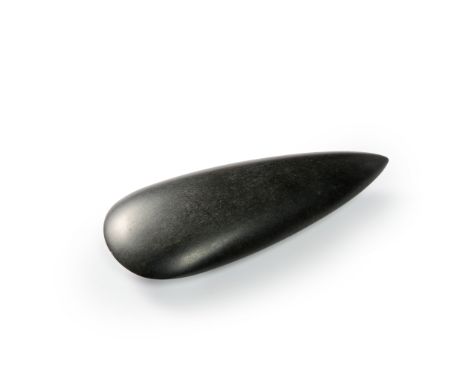 A Neolithic petaloid celt,  Taino culture, Americas, Circa 3rd Millenium B.C.the slender, polished axe head of dark stone, wi