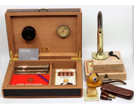 An S.T.Dupont cigar humidor, a S.T.Dupont gold plated lighter together with a collection of cigars, a trench art lighter in t