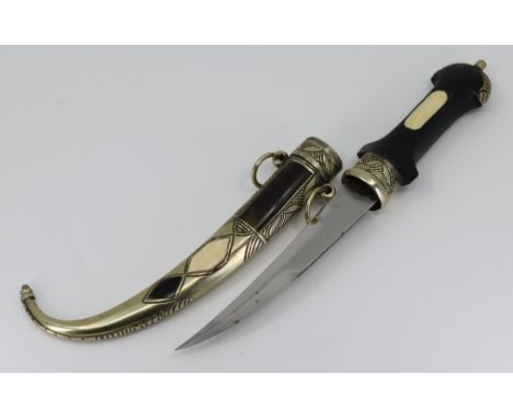 An early 20th Century Moroccan Koummya dagger with bone and horn panelled decoration, the grip made of horn having bone panel