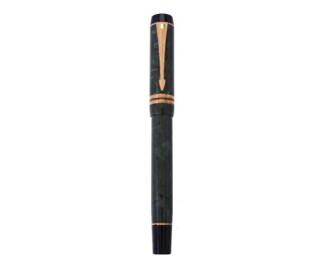 Parker, Duofold International, a green fountain pen, the cap with gilt arrow clip and double cap band, the oblique medium nib