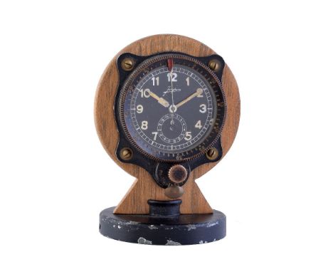 Junghans, 8 Day Aircraft Clock,   Chronograph with elapsed time indicator, mounted on a wood and metal stand, Device no. 2888