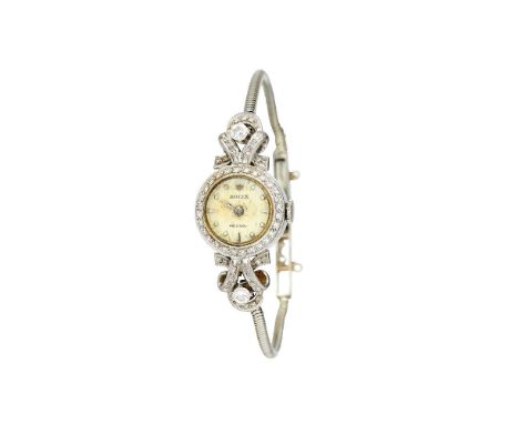 Rolex,   Lady's white gold coloured and diamond cocktail watch, circa 1930   Movement: Manual wind, 17 jewels   Case: White g
