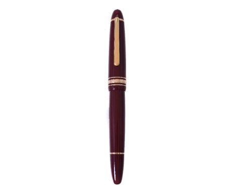 Montblanc, Meisterstuck 146, a burgundy fountain pen, the cap with a gilt clip and triple cap band, the fine nib stamped 14K,