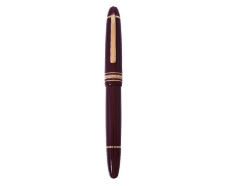 Montblanc, Meisterstuck 146, a burgundy fountain pen, the cap with a gilt clip and triple cap band, the fine nib stamped 14K,