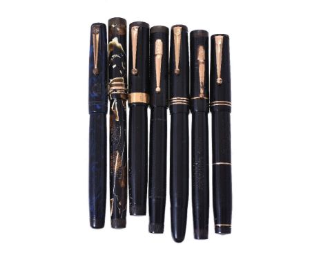 A collection of seven Swan fountain pens, to include: a black fountain pen, the cap with a gilt clip and an 18 carat gold cap