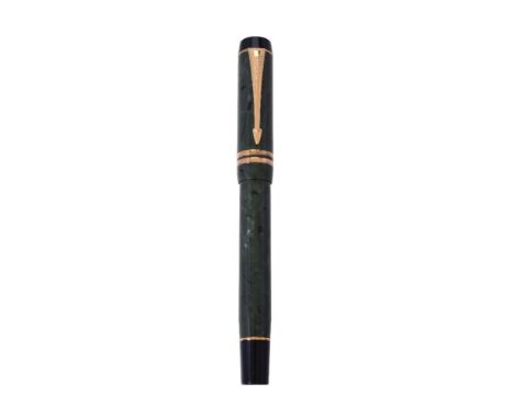 Parker, Duofold International, a green fountain pen, the cap with gilt arrow clip and double cap band, the oblique italic fin