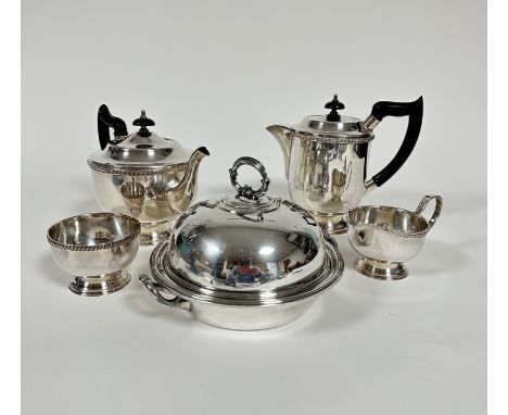 An Epns four piece tea and coffee service of cylinder form including teapot, coffee jug with black plastic composition handle