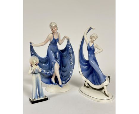 A set of three Katzhutte Art Deco figure of ladies, one holding both hems of her skirt up, (h: 32cm x 12cm) a standing figure