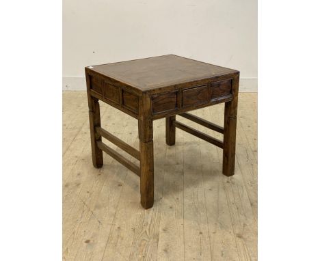 A late Qing Dynasty Chinese elm Mahjong or games table, the panelled top over drawer to each side, standing on and lifting of