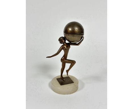 A World Framed Ingots spelter figure holding a globe with hinged top enclosing a lighter on circular alabaster base, (h: 19cm