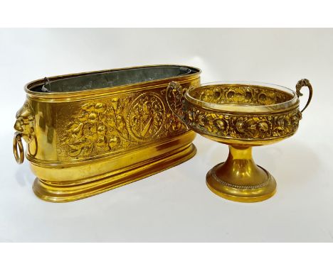 A brass trough/planter and liner with heraldic design in relief and lion's head/loop handles (h- 22cm, w- 47cm), together wit