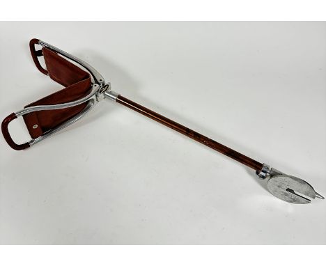 A Gamebird aluminum leather mounted shooting stick with fold down top with leather padded seat, on bronzed column and adjusta