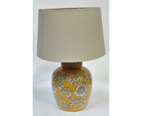 A modern ceramic ginger jar style ochre yellow table lamp decorated with chrysanthemum all over design. (h- 48cm)