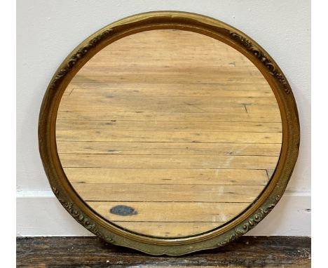 A 1920's / 30s vintage circular moulded gilt composition frame wall mirror (d: 34cm)