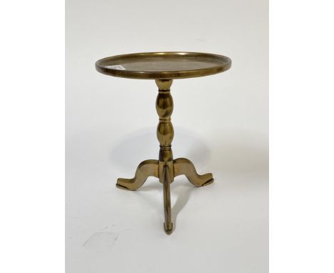 A miniature Georgian style cast brass tripod table, circular tray top raised on bobbin column and triple splay supports, H21c