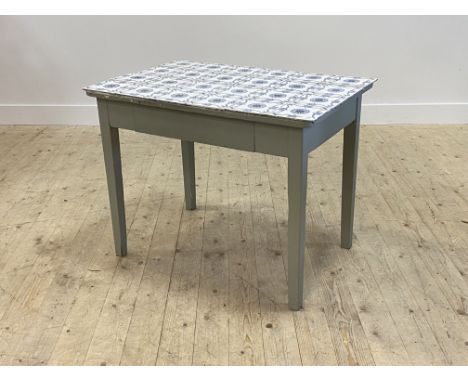 An early 20th century painted pine side table, the later tile top over freize drawer, raised on square tapered supports, H72c