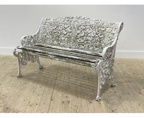 A Victorian style white painted aluminium garden bench, the back rest in the form of trailing vines and foliate, above a slat