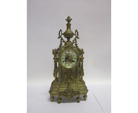 A LATE 19TH CENTURY CONTINENTAL MANTLE CLOCK the enamel dial with Roman numerals and striking on a bell and contained in an o