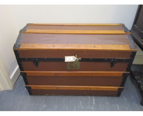 A METAL BOUND DOME TOP CABIN TRUNK 77cm wide, 52cm high