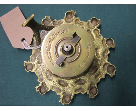 A VICTORIAN BRASS DESK CLOCK the white enamel chapter ring with black Arabic numerals, the cast case with a repeating pattern