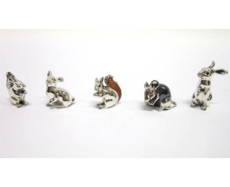 A SILVER MODEL OF A MOUSE  in an oxidised type finish, London import 2003, 2.4cm long; two models of squirrels, one with resi