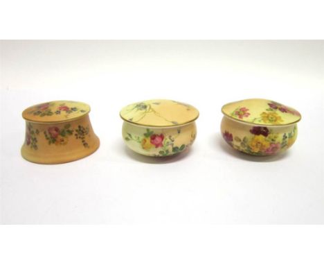 THREE ROYAL WORCESTER PORCELAIN LIDDED BOXES with blush ivory background and hand painted floral decoration, 4.5cm high