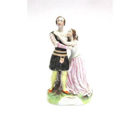 A 19TH CENTURY STAFFORDSHIRE PORTRAIT FIGURAL GROUP Romeo and Juliet, locked in an embrace, 26cm high