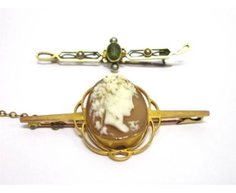A SHELL CAMEO BAR BROOCH stamped '9c', 5.1cm long, 5.8g gross; with a peridot and seed pearl brooch, unmarked 