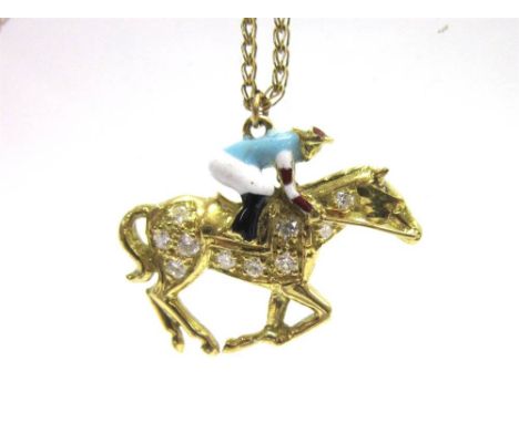 AN 18CT GOLD DIAMOND AND ENAMEL JOCKEY AND RACEHORSE PENDANT the galloping horse set with ten brilliant cuts totalling approx