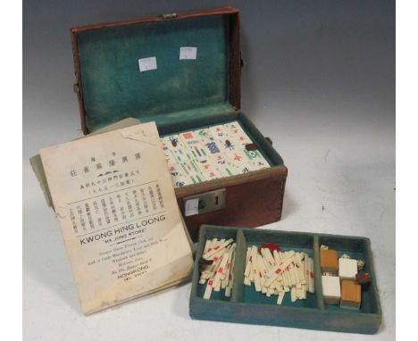 A vintage leather cased Chinese Mahjong set