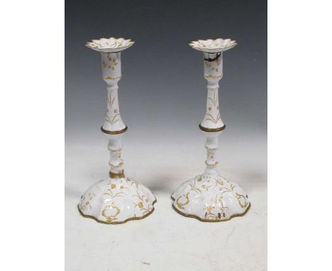 A pair of 18th century Bilston or Battersea enamel candlesticks, 28cm highSevere damage to the enamel on both candlesticks. F