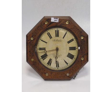A 19th century wall clock 'M. Currie - Greenock', in a octagonal case, 32cm wide; a set of brass postal scales, 32cm wide (2)
