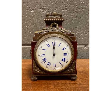 A 19th century faux Tortoiseshell and gilt metal mounted clock, the enamel dial with Roman chapter ring and outer Arabic seco